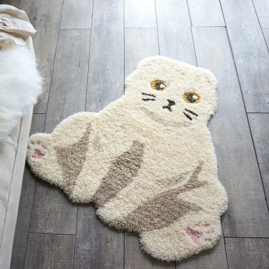 猫ちゃんのユニークな座り方をモチーフにしたアクセントラグ＜Ojinya