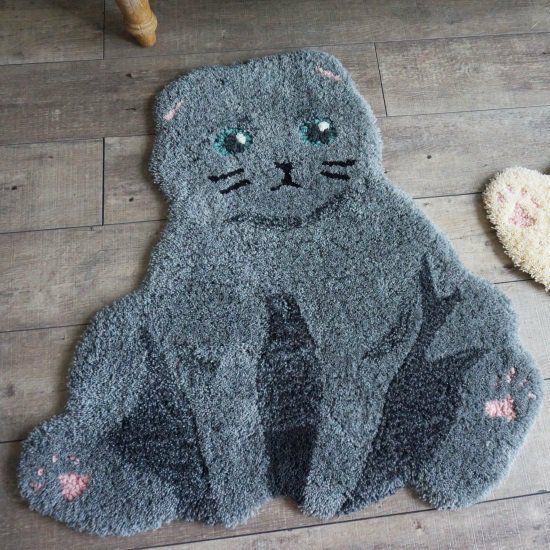 猫ちゃんのユニークな座り方をモチーフにしたアクセントラグ＜Ojinya